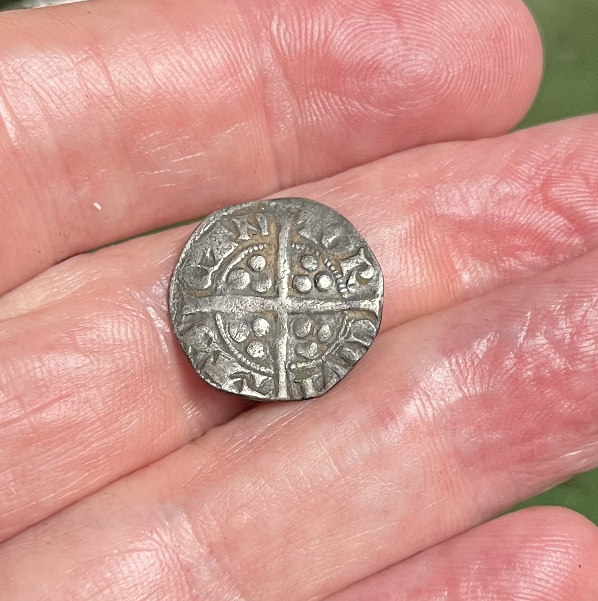 After the Storm: A 700-Year-Old Medieval Hammered Silver Coin Emerges from Rain-Soaked Soil
